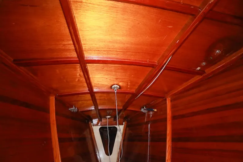 Slide: The Image of Interior view of 1983 Nelson Marek 36 sailboat with polished wooden finish. - 15