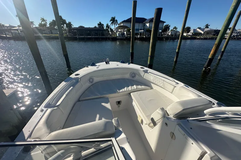 Slide: The Image of 2023 Edgewater 248CX Crossover boat interior with waterfront view and sunny weather. - 7