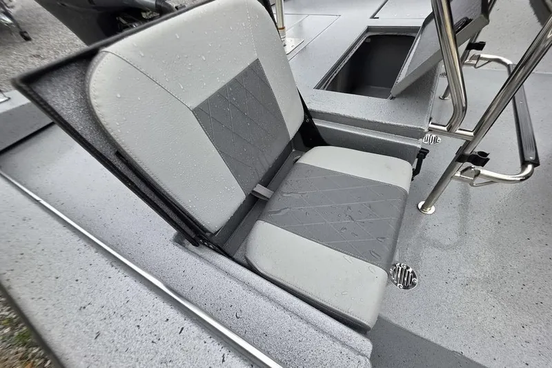 Slide: The Image of 2025 Xpress H22B Bay boat seat with storage compartment, featuring gray upholstery and stainless steel accents. - 10