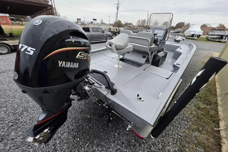 Slide: The Image of 2025 Xpress H22B Bay boat with Yamaha 175 engine, parked on gravel. - 15