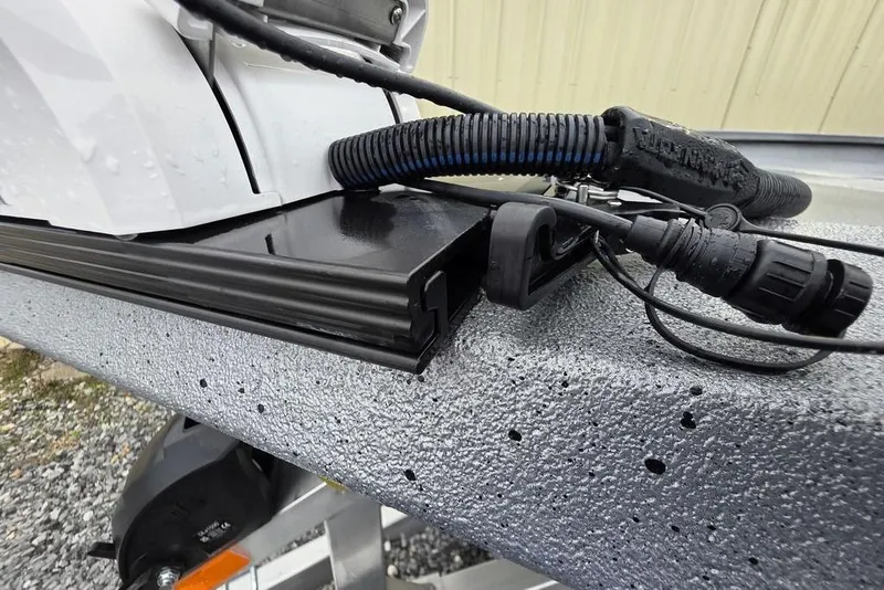 Slide: The Image of Close-up of 2025 Xpress H22B Bay boat wiring and textured surface. - 17