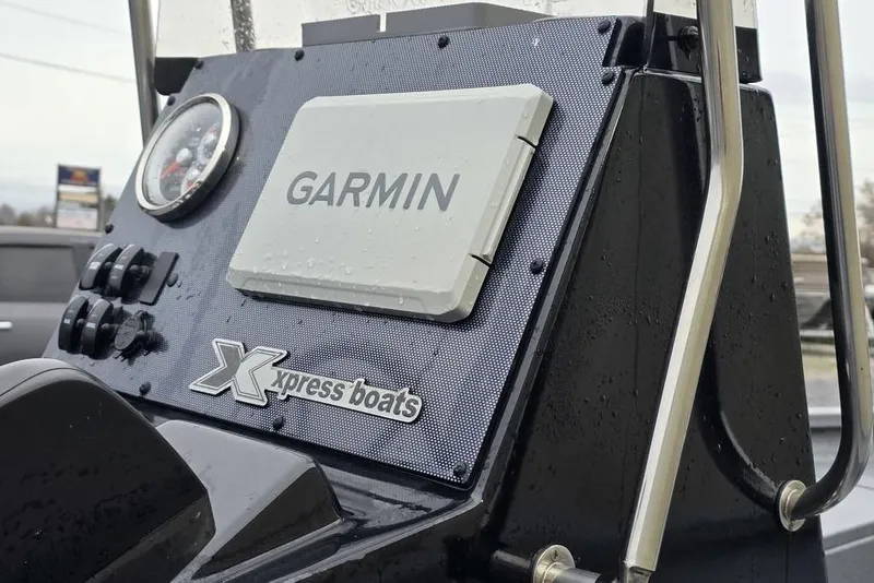 Slide: The Image of 2025 Xpress H22B Bay boat dashboard with Garmin navigation system. - 19