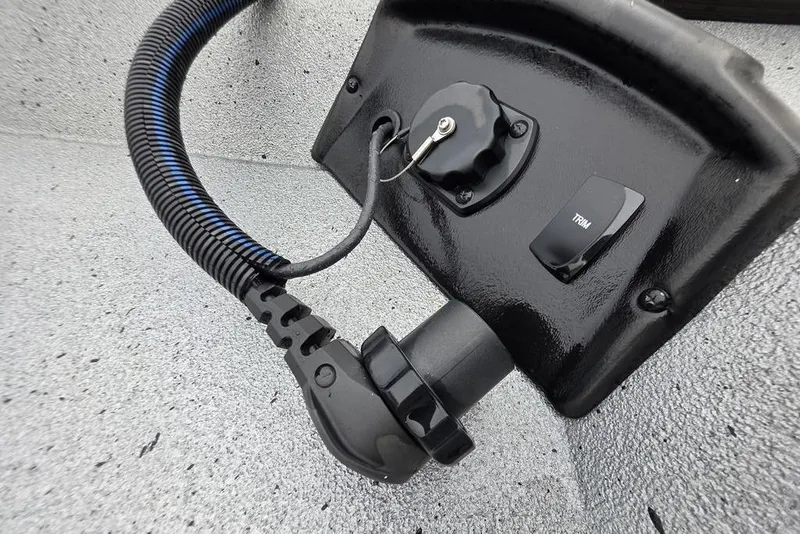 Slide: The Image of 2025 Xpress H22B Bay boat control panel with trim switch and wiring. - 22