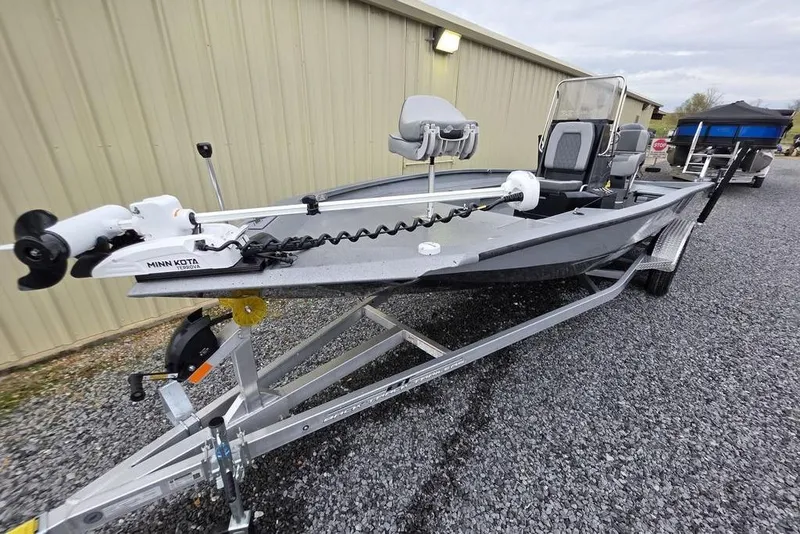 Slide: The Image of 2025 Xpress H22B Bay boat on trailer with Minn Kota trolling motor. - 3