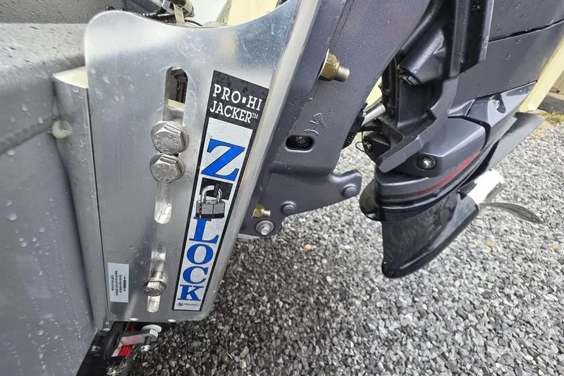 Slide: The Image of Close-up of 2025 Xpress H22B Bay boat's Z-Lock Pro Hi Jacker mechanism. - 8