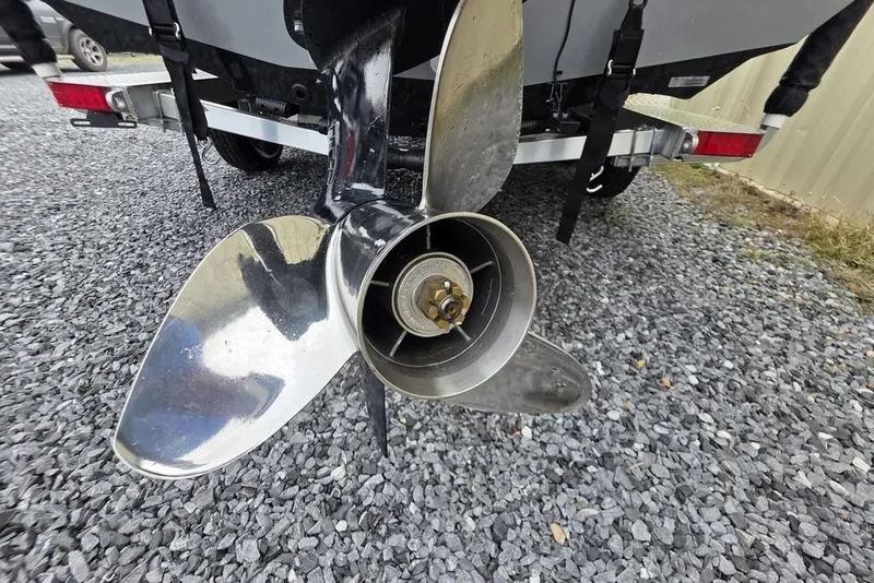 Slide: The Image of 2025 Xpress H22B Bay boat propeller on gravel surface. - 9
