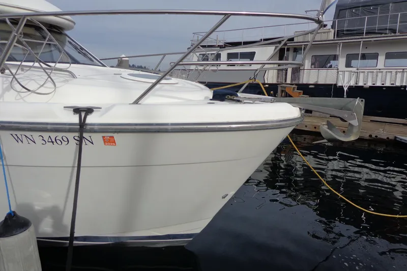 Slide: The Image of 2001 Bayliner 3488 Command Bridge Motoryacht docked in a marina. - 11