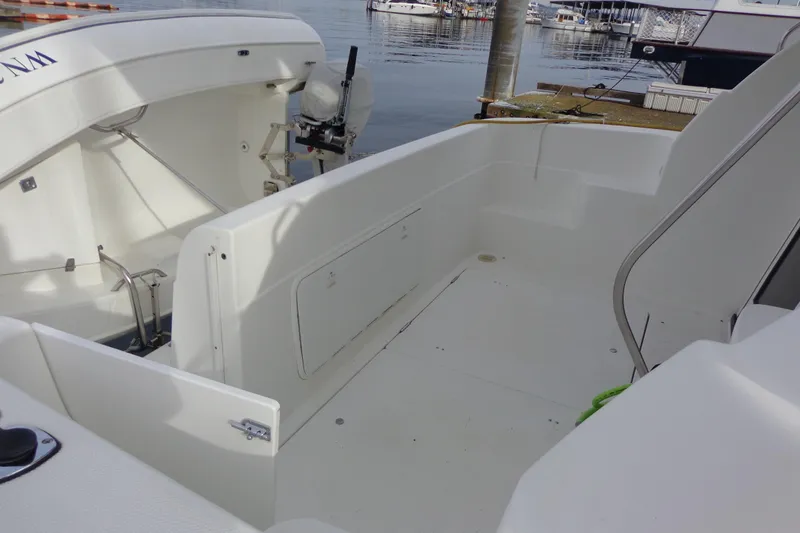 Slide: The Image of 2001 Bayliner 3488 Command Bridge Motoryacht docked, showing bow and registration number. - 12