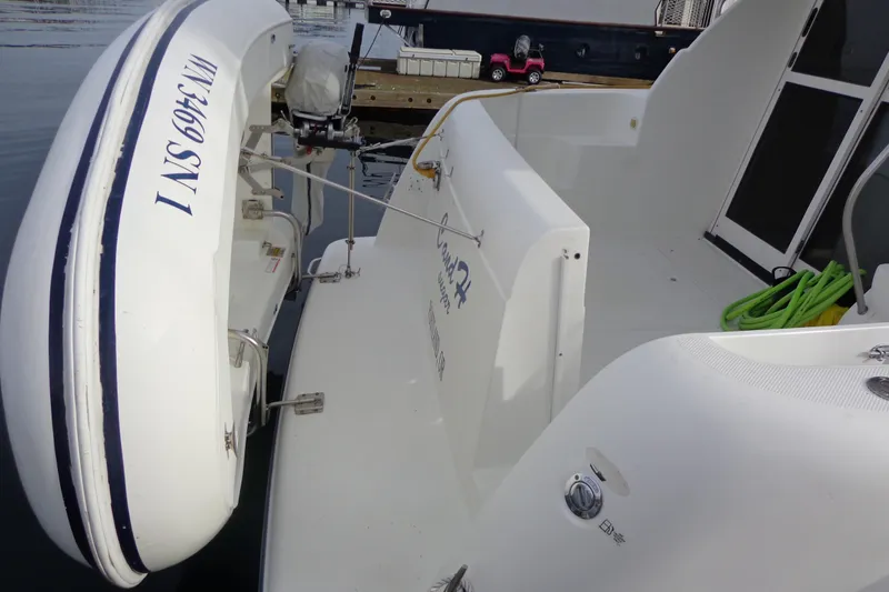 Slide: The Image of 2001 Bayliner 3488 Command Bridge Motoryacht deck, featuring spacious seating and clean design. - 13