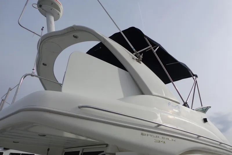 Slide: The Image of 2001 Bayliner 3488 Command Bridge Motoryacht with sleek design and black canopy. - 14