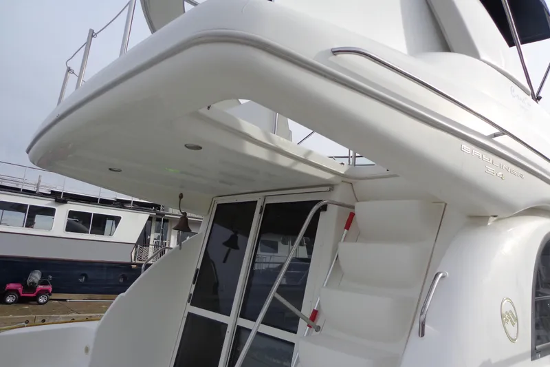 Slide: The Image of 2001 Bayliner 3488 Command Bridge Motoryacht, rear view with stairs and glass doors. - 16