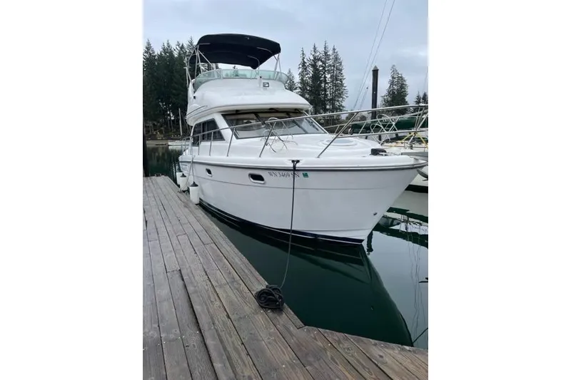 Slide: The Image of 2001 Bayliner 3488 Command Bridge Motoryacht on dry dock, side view. - 2