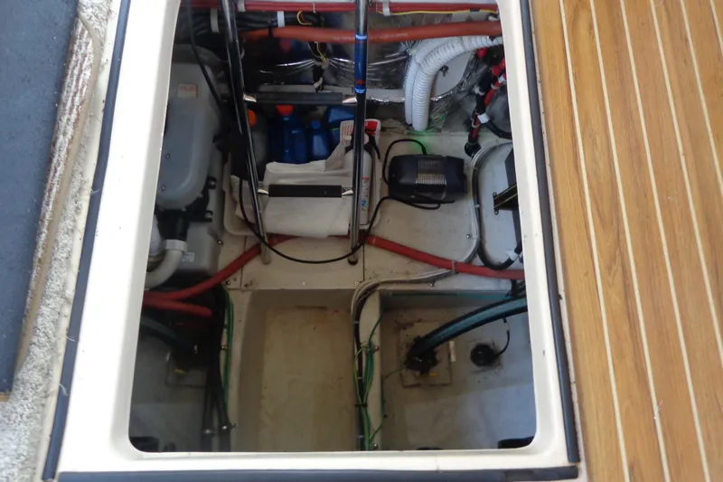 Slide: The Image of Engine compartment of 2001 Bayliner 3488 Command Bridge Motoryacht, showing mechanical components and wiring. - 20