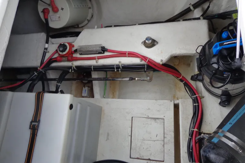 Slide: The Image of Engine compartment of 2001 Bayliner 3488 Command Bridge Motoryacht with visible wiring and components. - 21