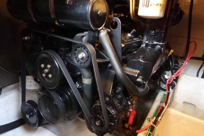 Slide: The Image of Engine compartment of a 2001 Bayliner 3488 Command Bridge Motoryacht, showcasing mechanical components. - 23