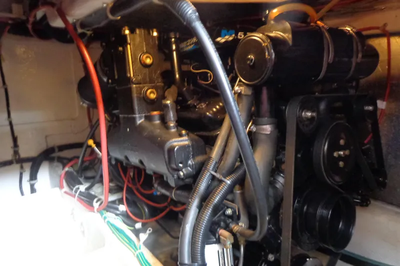 Slide: The Image of Engine compartment of 2001 Bayliner 3488 Command Bridge Motoryacht with visible wiring and components. - 24