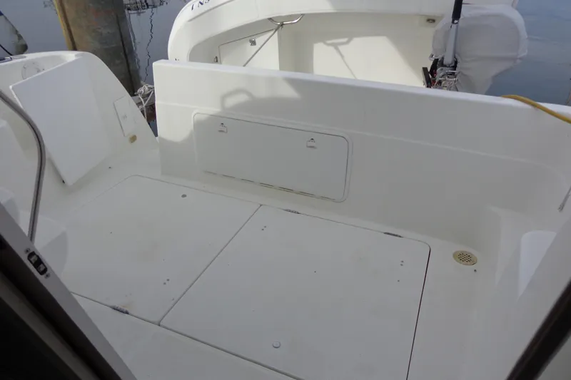 Slide: The Image of 2001 Bayliner 3488 Command Bridge Motoryacht deck area, featuring clean white surfaces. - 27
