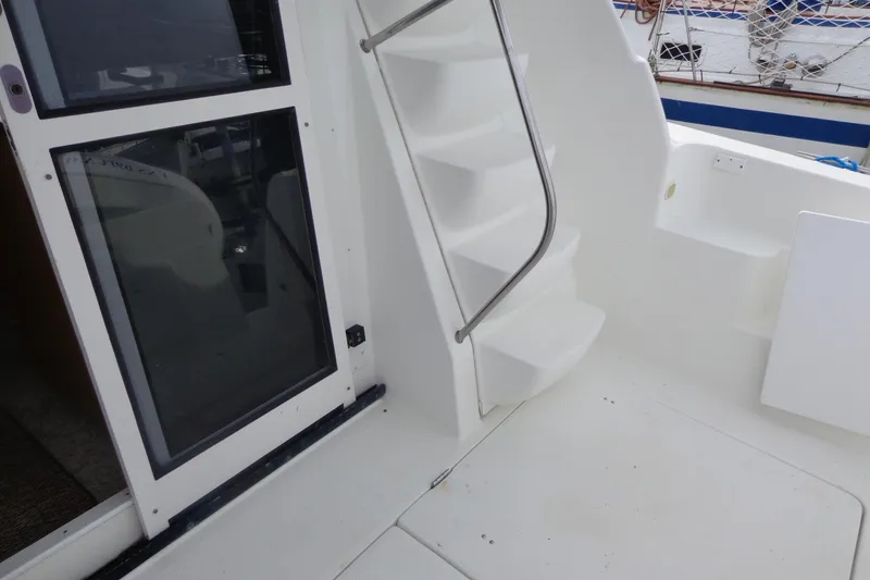 Slide: The Image of 2001 Bayliner 3488 Command Bridge Motoryacht interior with stairs and sliding door. - 28