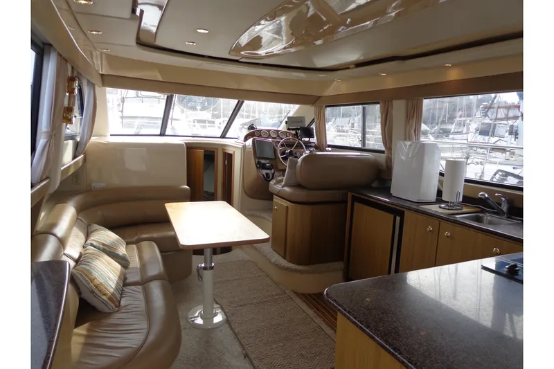 Slide: The Image of Luxurious interior of 2001 Bayliner 3488 Command Bridge Motoryacht with seating and helm. - 35