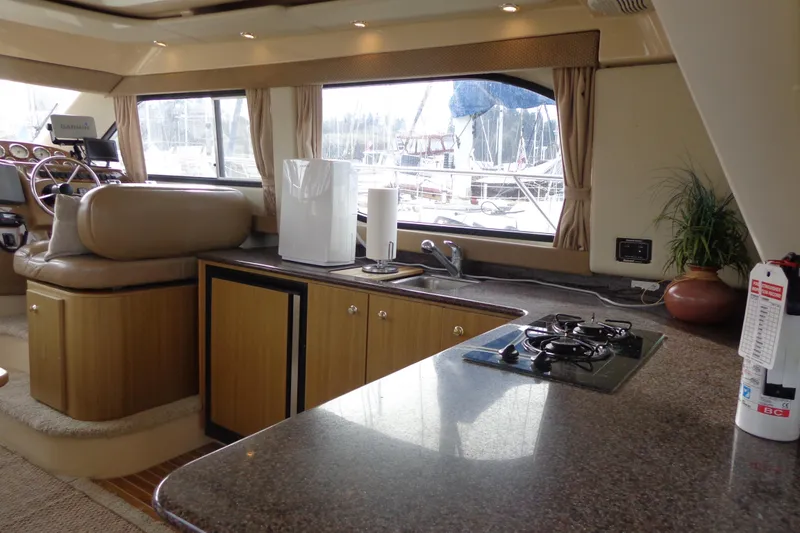 Slide: The Image of Interior of 2001 Bayliner 3488 Command Bridge Motoryacht with kitchen and helm station. - 36