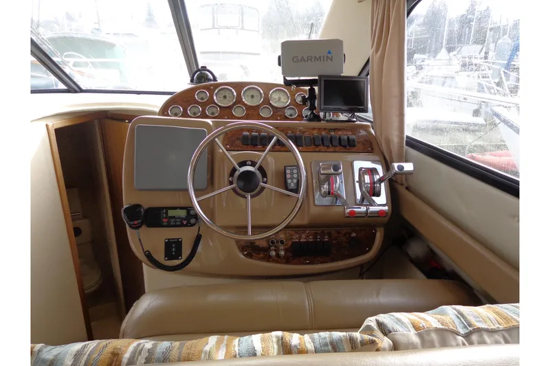 Slide: The Image of 2001 Bayliner 3488 Command Bridge Motoryacht helm with Garmin navigation system. - 38