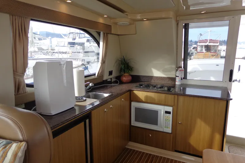 Slide: The Image of Interior of 2001 Bayliner 3488 Command Bridge Motoryacht with kitchenette and appliances. - 41