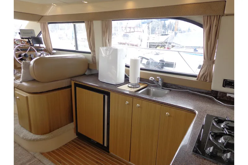Slide: The Image of Interior of 2001 Bayliner 3488 Command Bridge Motoryacht with kitchen and helm station. - 42