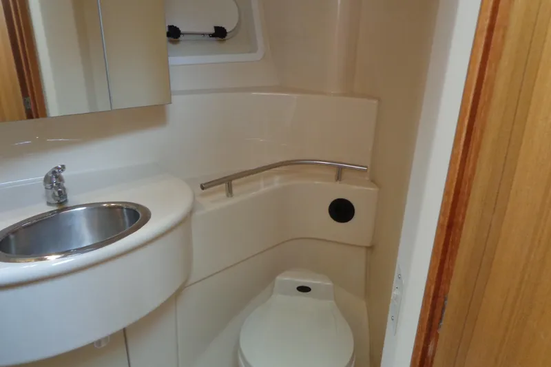 Slide: The Image of 2001 Bayliner 3488 Command Bridge Motoryacht bathroom with sink and toilet. - 47