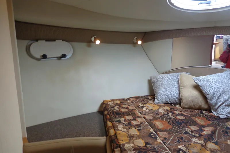 Slide: The Image of Interior cabin of 2001 Bayliner 3488 Command Bridge Motoryacht with cozy bed and decorative pillows. - 52