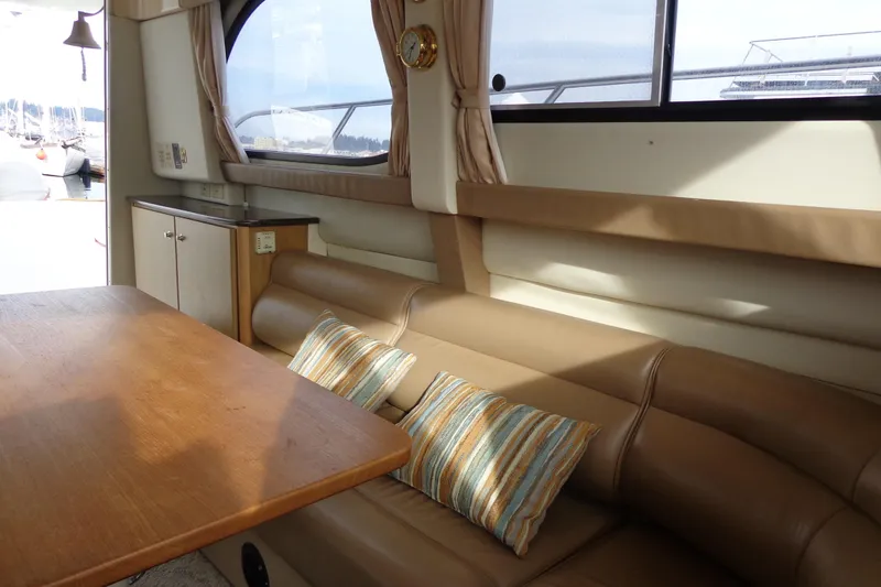 Slide: The Image of Interior of 2001 Bayliner 3488 Command Bridge Motoryacht with seating and table. - 54