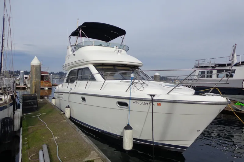 Slide: The Image of Inflatable boat on trailer, viewed from rear, with grassy background. - 8