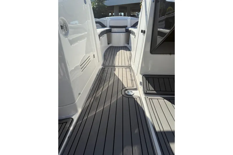Slide: The Image of 2017 Yamaha Boats 242 Limited S E-Series interior with sleek deck design. - 16