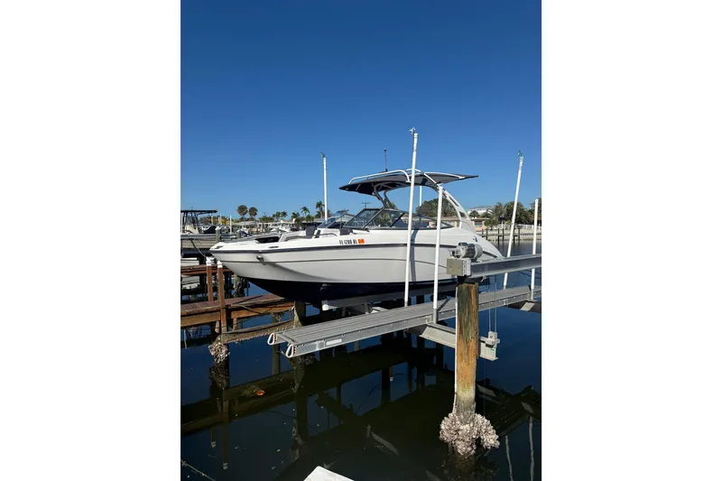 Slide: The Image of 2017 Yamaha Boats 242 Limited S E-Series on a dock under clear blue sky. - 3