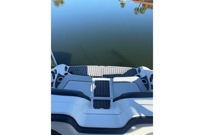 Slide: The Image of 2017 Yamaha Boats 242 Limited S E-Series swim platform on calm water. - 9