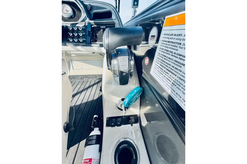 Slide: The Image of 2019 Barletta L23UC boat dashboard with controls and safety instructions. - 24