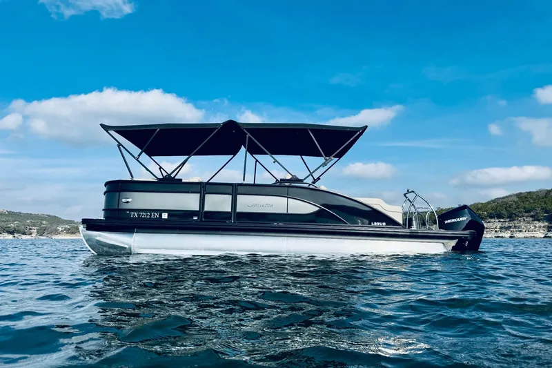 Slide: The Image of 2019 Barletta L23UC pontoon boat on a sunny lake with blue skies. - 3