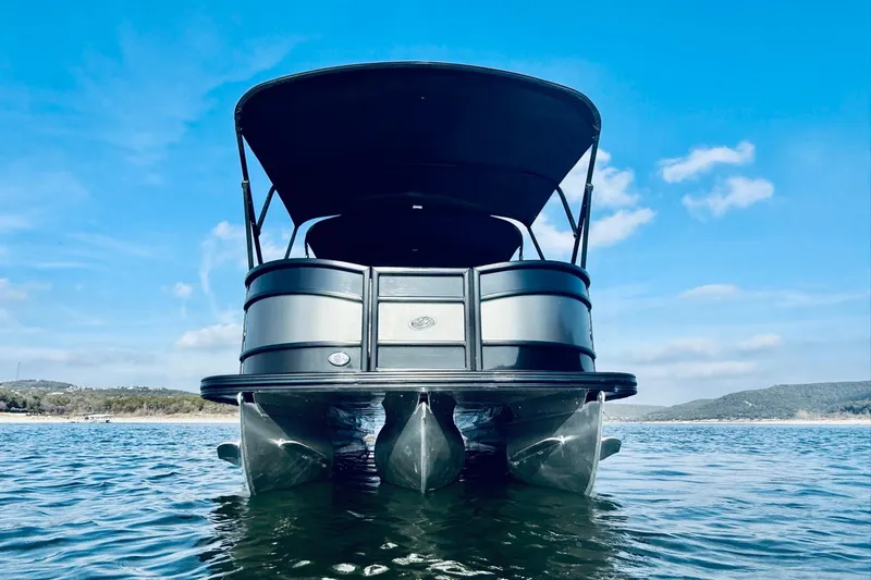 Slide: The Image of 2019 Barletta L23UC pontoon boat on water under clear blue sky. - 8