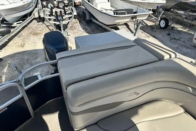 Slide: The Image of 2015 Bennington 21gs boat interior with steering wheel and seating. - 11