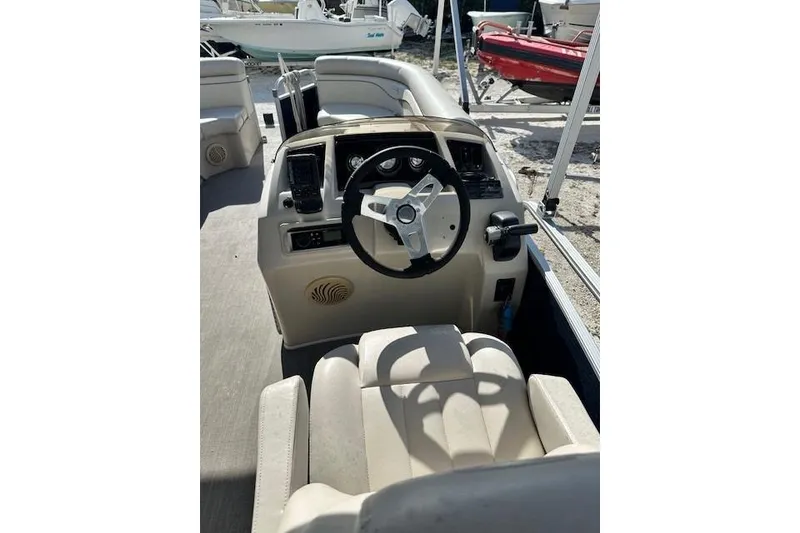 Slide: The Image of 2015 Bennington 21gs pontoon boat with Yamaha outboard motor on trailer. - 8