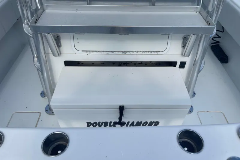 Slide: The Image of 2016 Contender 39 ST boat interior with storage compartment labeled "Double Diamond." - 16