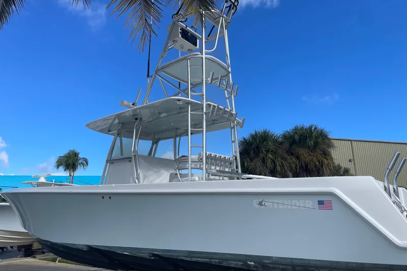 Slide: The Image of 2016 Contender 39 ST boat with tower against blue sky and palm trees. - 3