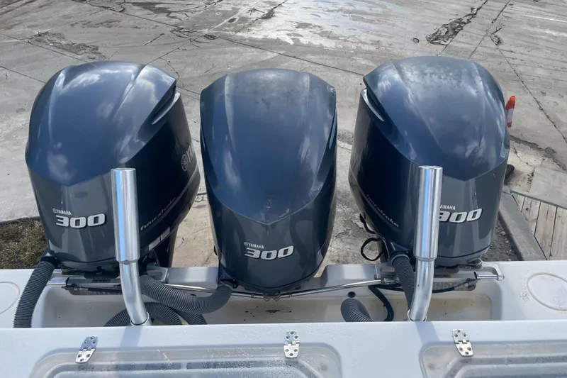 Slide: The Image of Triple Yamaha 300 outboard engines on a 2016 Contender 39 ST boat. - 7