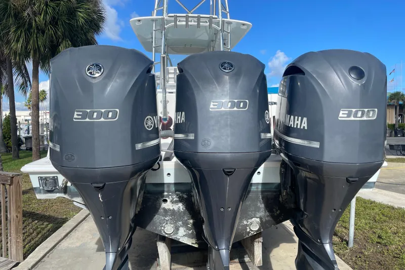 Slide: The Image of Three Yamaha 300 outboard motors on a 2016 Contender 39 ST boat. - 9