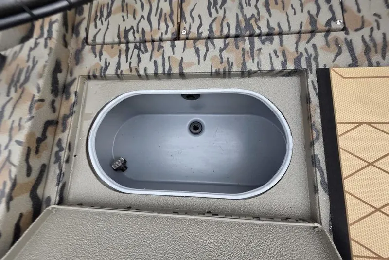 Slide: The Image of 2026 Xpress H190B Bay boat livewell with camouflage interior design. - 11