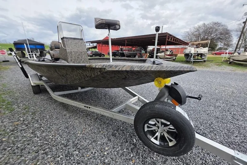 Slide: The Image of 2026 Xpress H190B Bay boat on trailer, parked outdoors on gravel. - 15