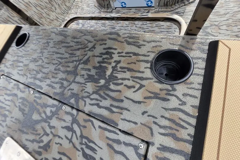 Slide: The Image of 2026 Xpress H190B Bay boat interior with camouflage pattern and cup holder. - 18
