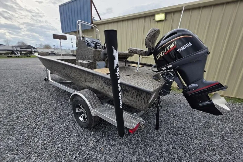Slide: The Image of 2026 Xpress H190B Bay boat with Yamaha engine on trailer, parked outdoors. - 7
