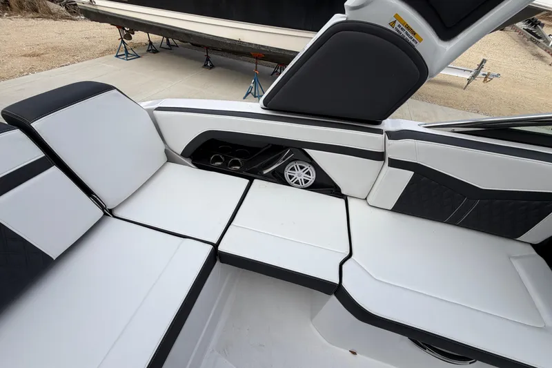 Slide: The Image of 2025 Monterey 278SS Super Sport boat interior with sleek black and white seating. - 10