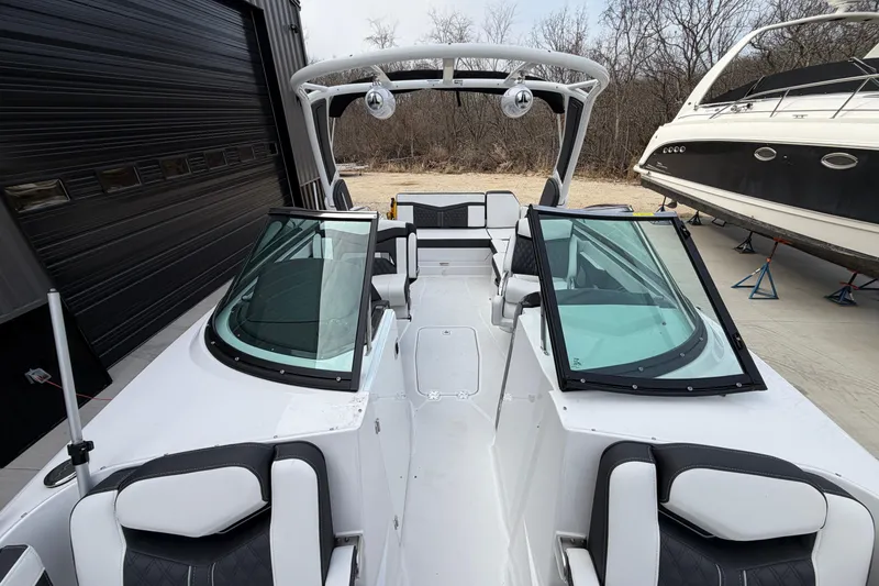 Slide: The Image of 2025 Monterey 278SS Super Sport boat interior with white and black seating. - 18