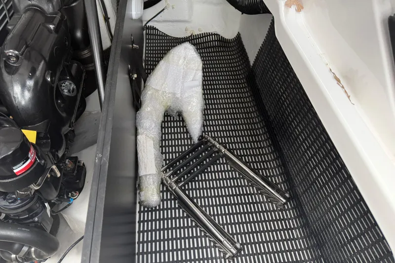 Slide: The Image of Engine compartment of 2025 Monterey 278SS Super Sport boat, showcasing mechanical components and wiring. - 38